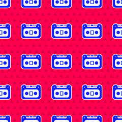 Blue Retro audio cassette tape icon isolated seamless pattern on red background. Vector