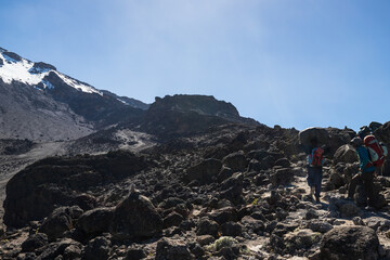 Fototapeta premium Conquering Kibo: The Rocky Path to Kilimanjaro’s Summit