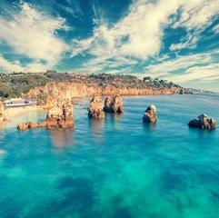 Afwasbaar Fotobehang Marinha Beach, Algarve, Portugal Seascape with cloudy sky. Rocky seashore. Arrifes beach (Praia dos Arrifes), Albufeira, Portugal.