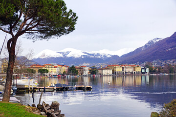 Stunning panorama view of Lugano Lake, cityscape of Lugano, mountain Monte Bre and Swiss Alps 