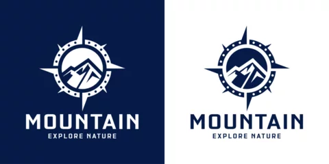 Fotobehang compass and mountain silhouette logo design © reza