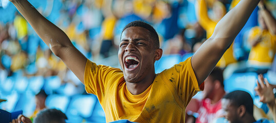 A joyful fan at a football event, joyfully shouting and gesturing, raising his hands in the air, showing his love for the game. - obrazy, fototapety, plakaty