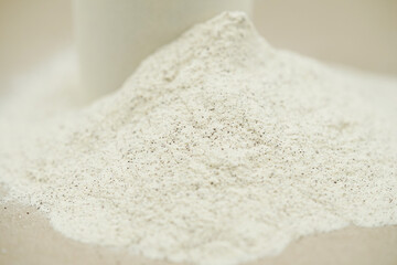 Close up of plant protein. Whey protein powder background.