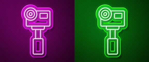 Glowing neon line Action extreme camera icon isolated on purple and green background. Video camera equipment for filming extreme sports. Vector
