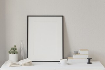 Mockup frame, on the work desk in a luxurious morning space with a coffee cup, a book, a cactus vase, home office concept. Scandinavian interior design interior room background, 3d rendering.