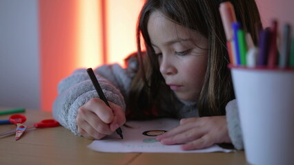 Artistic Child Deeply Engaged in Drawing, Focused on Paper with Coloring Pen, bucket of coloring pens in foreground