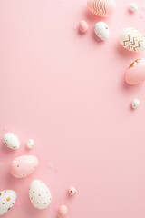 Sophisticated Easter setting vision: vertical top view of dyed eggs, and confetti spread on a pastel pink foundation, intentionally leaving empty space for any greeting text or advertisement purposes