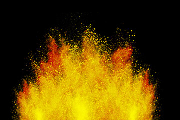 Abstract powder splatted background. Colorful powder explosion on black background. Colored cloud. Colorful dust explode. Freeze motion of orange color powder exploding 