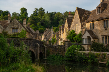 Fairy tale country village with charming stone terraced houses of honey colour
