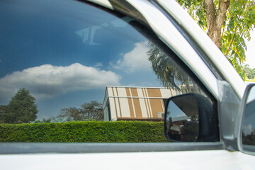 Corner of the building, reflected from the car window. New perspective on life