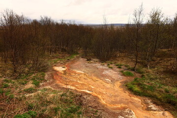 The Geysir geothermal field is a collection of hot springs, a dome and a volcanic cone that make up the remains of an ancient volcano in Iceland.