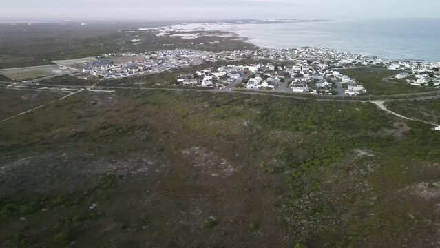 South African beautiful village Arniston embedded in Sand Dunes and a turquoise sea coast line
