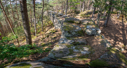 Mont Sainte Odile, France - 09 11 2020: Path of the Gauls. View of the pagan stone wall, stairs and trees .