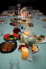 Table decoration in the form of vases and candles.