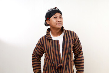 Smiling Confident Asian man standing while looking at the camera. Isolated on white