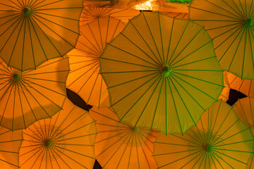 Paper umbrellas overlapped handing from ceiling