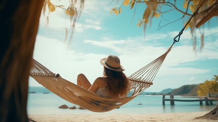Serene beach scene with a woman enjoying the sun, sand, and sea under a blue sky in tropical Thailand