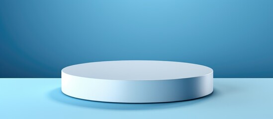 A minimalist pedestal on a blue surface showcasing a white round object. The simple design allows the object to stand out against the vibrant background.