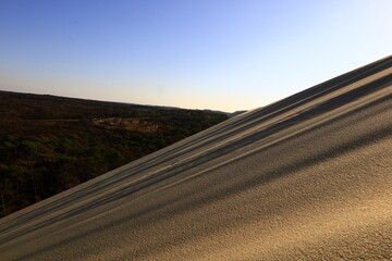 Naklejka premium The Dune of Pilat is the tallest sand dune in Europe. It is located in La Teste-de-Buch in the Arcachon Bay area, France