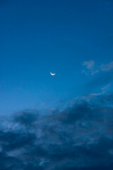 The waning moon in the predawn sky.