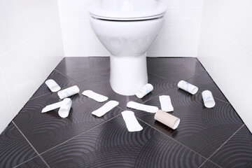 White home toilet with menstrual pads. Quarantine concept.
