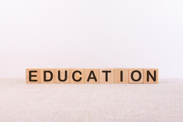Education word concept written on a light table and light background