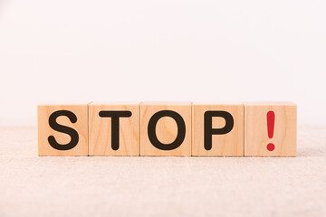 STOP word concept written on a light table and light background