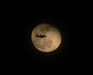 Airliner Crossing a Full Moon (one of three)