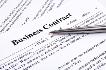 The pen lies on the contract. Business relationship concept.
