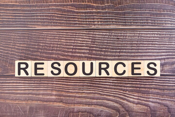 RESOURCES word made with wood building blocks