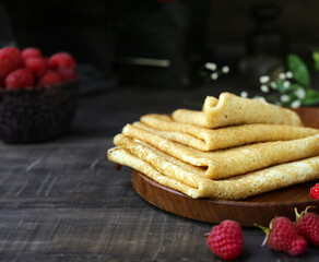 homemade thin pancakes with berries for breakfast and dessert