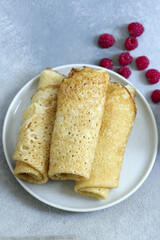 homemade thin pancakes with berries for breakfast and dessert
