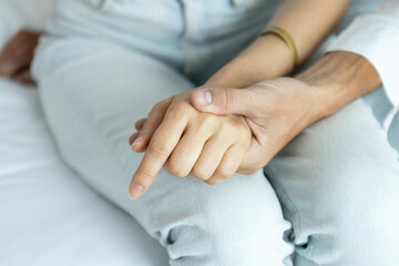 close up hand love and care support male love woman, hand caring help comfort.