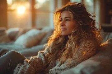  Tranquil woman in knitted sweater enjoying the golden hour sunlight © svastix