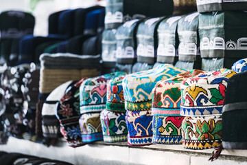 Traditional headdresses skullcaps at the Siab bazaar in the ancient city of Samarkand in...
