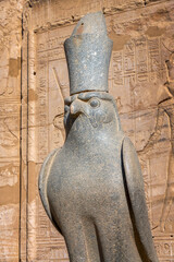 Ancient Falcon statue of egyptian god Horus in the temple of Edfu on the Nile river West bank, Egypt - 748849750