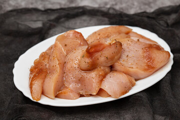 raw Chicken breast fillet with sauce, poultry meat steaks in plate