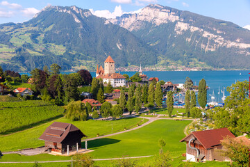 Panorama with Spiez Church and Castle on Lake Thun in Swiss canton of Bern, Spiez, Switzerland.