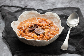 typical portuguese dish with beans and smoked sausages