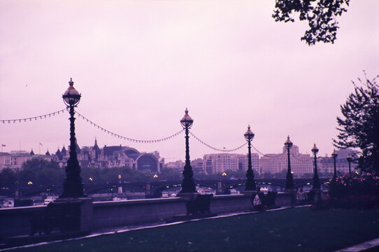 Looking toward the Westminster Bridge, the royal horseguards hotel and Charing Cross Station along the River Thames in London during early 1990s