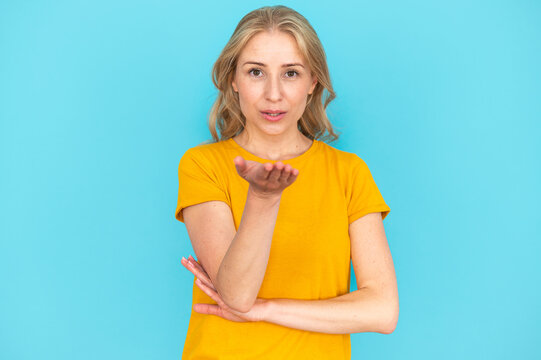 Woman blowing air kiss and express sincere feelings, love, flirt