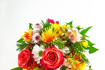 Bouquet of red roses and various flowers on a white background; Happy mother's or birthday concept