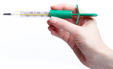 glass mercury thermometer in hand on white background isolation