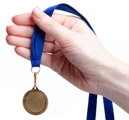 gold medal in hand on white background isolation, concept for winning or success