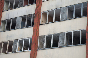 Fototapeta na wymiar building facade with broken windows