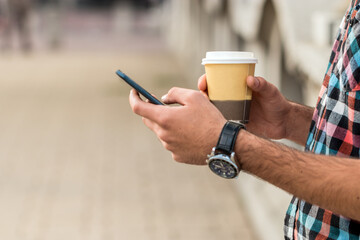 A handsome hipster
man sending text message.