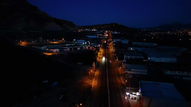Aerial View of Factories with Evening Traffic on City Roads