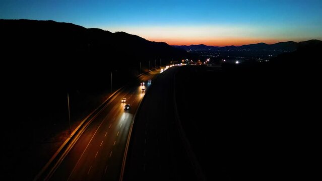 Aerial View of Factories with Evening Traffic on City Roads