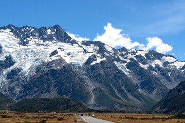 A beautiful view of a route leading to one of the most famous destination for tourist, Mount Cook National Park, in a peaceful summer day, New Zealand.