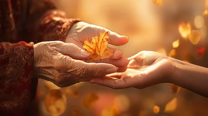 Photo sur Plexiglas Vielles portes hands of an elderly woman and a young girl in autumn background